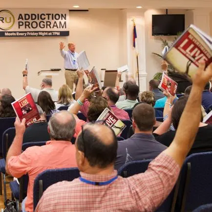 Adults participating together in an RU recovery meeting
