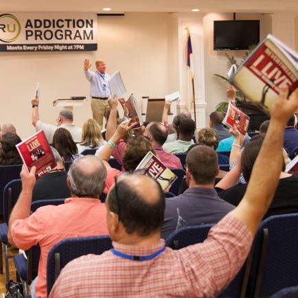Adults participating together in an RU recovery meeting