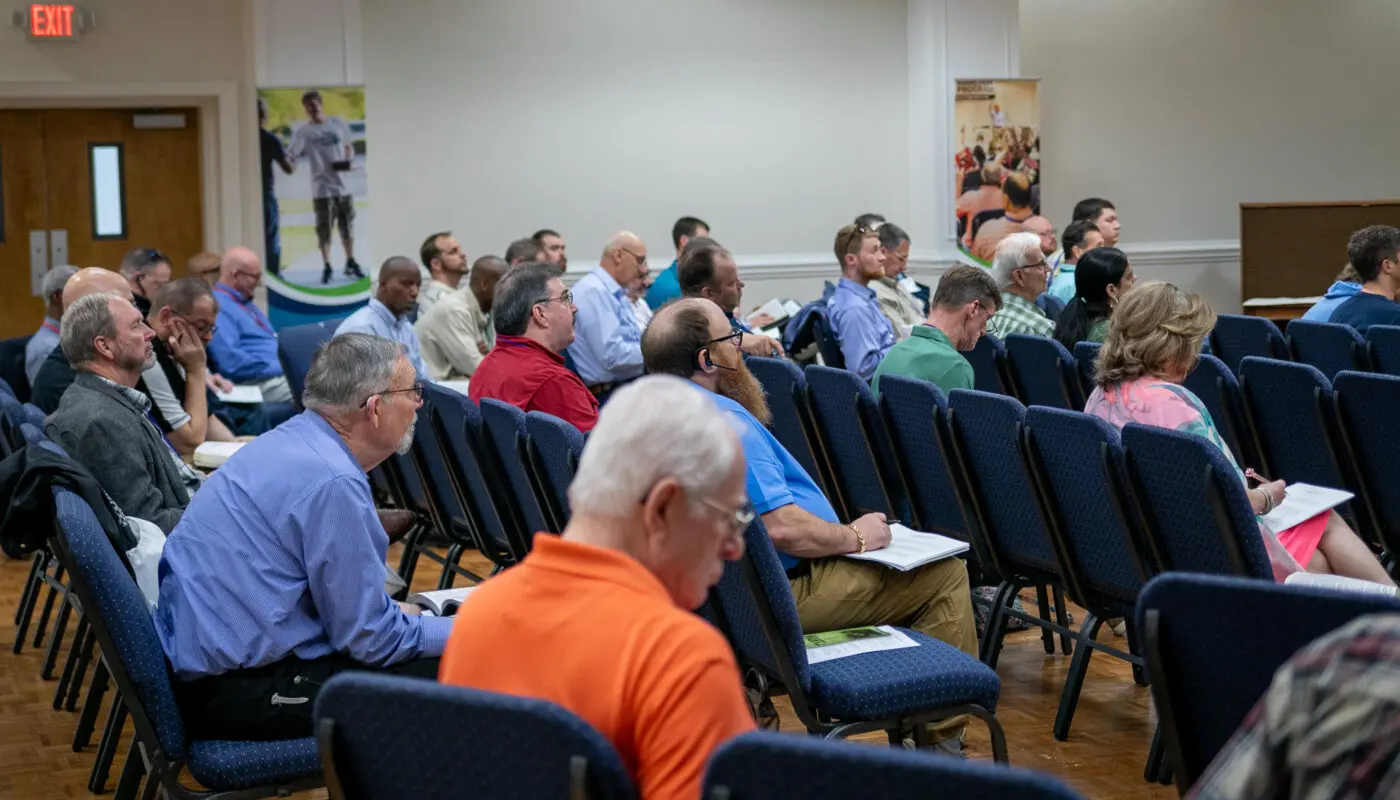 People listening and supporting one another in a recovery group