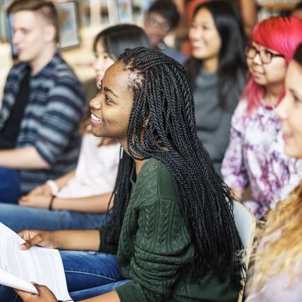 Teens learning together during a Full Throttle meeting